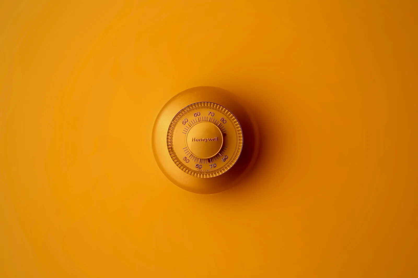 Honeywell smart thermostat on a wall