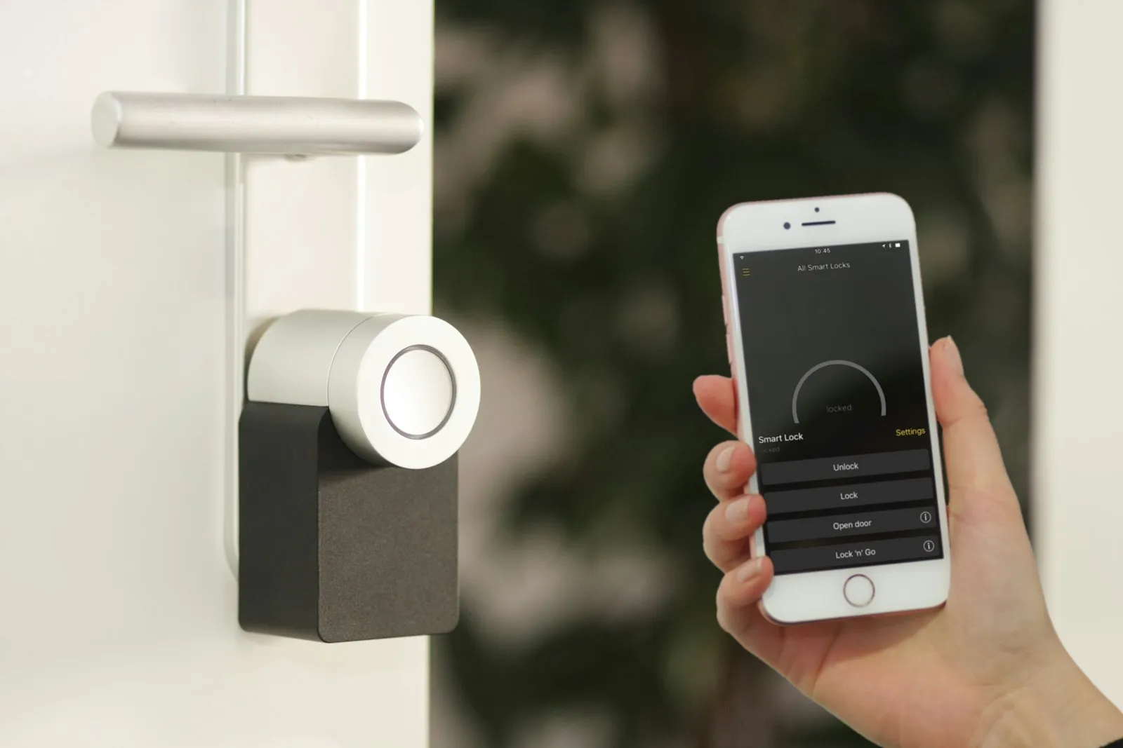 Smartphone held at a door for smart lock access